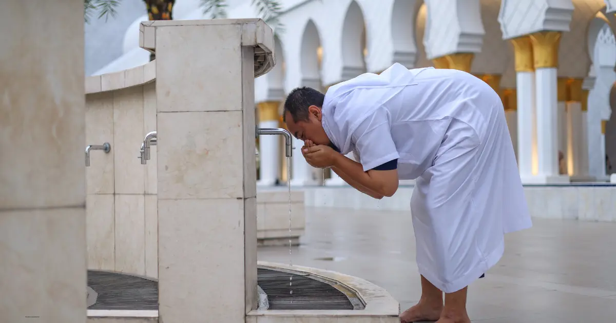 What is wudu?Muslim performing wudu before prayer following Islamic purification guidelines